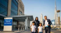 Expats with health insurance documents outside a Dubai hospital