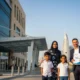 Expats with health insurance documents outside a Dubai hospital