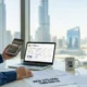UAE freelancer viewing VAT registration form on laptop with cityscape in background